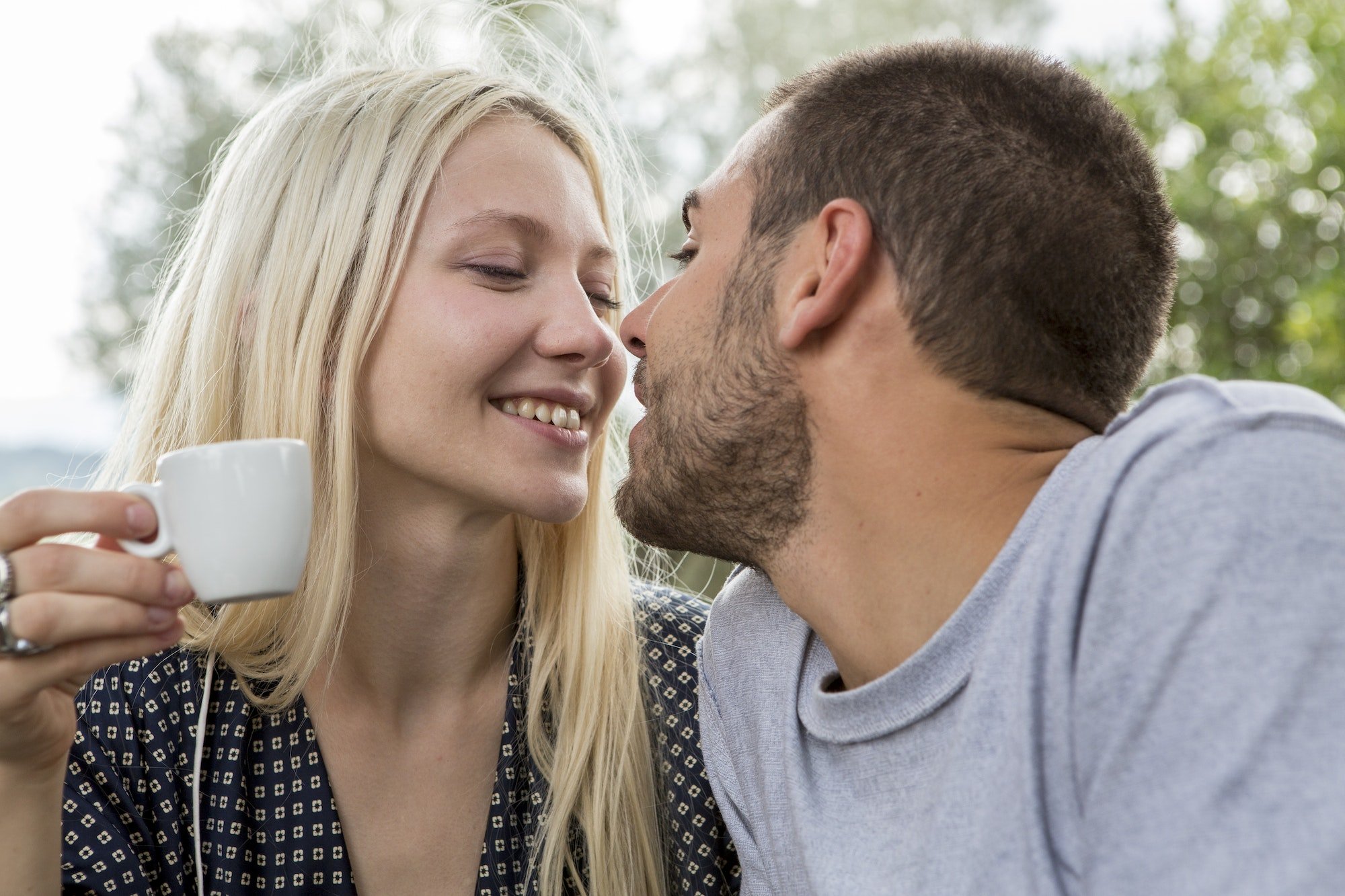 Kissing couple in love in the morning